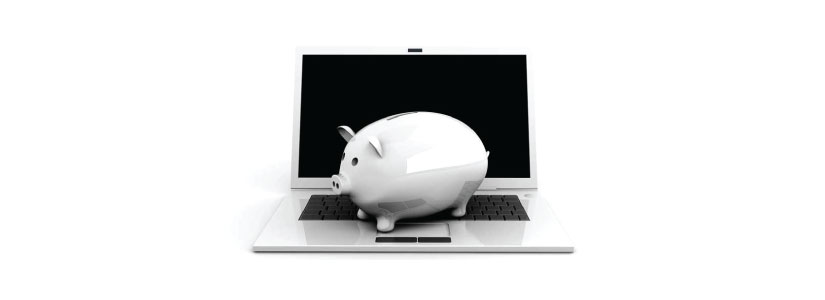 Piggy bank on laptop